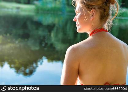 Woman with red hair. Woman with red hair on the lake