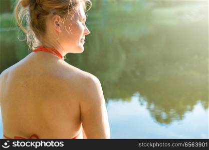 Woman with red hair. Woman with red hair on the lake with sun light