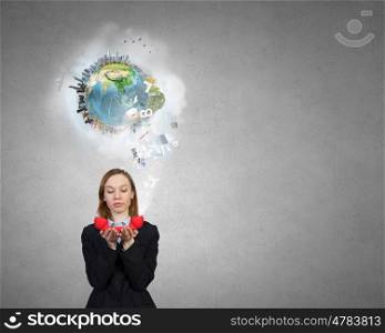 Woman with red handset. Portrait of young businesswoman with red phone receiver in hands. Elements of this image are furnished by NASA