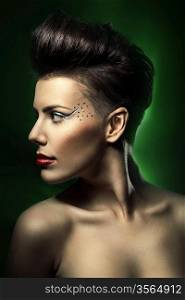woman with red lips in dark green light