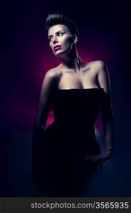 woman with red lips in dark magenta light