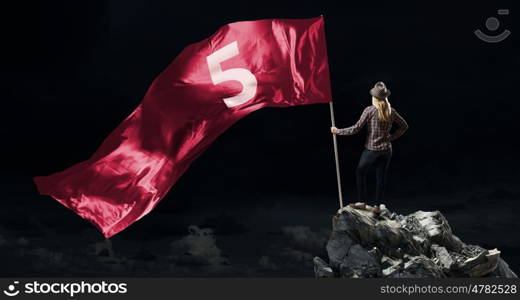 Woman with red waving flag. Student girl in casual with red flag in hands