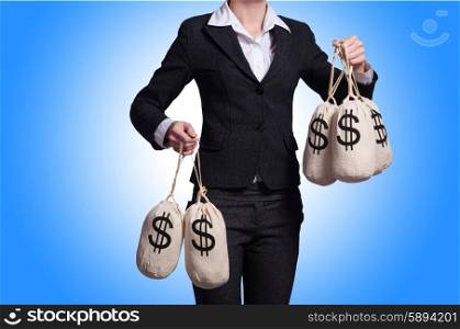 Woman with sacks of money on white