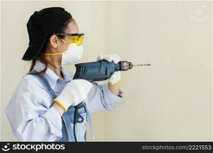 woman with safety protection equipment working