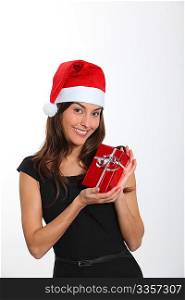 Woman with Santa hat holding Christmas present