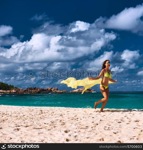 Woman with sarong at Seychelles beach