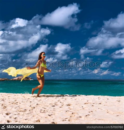 Woman with sarong at Seychelles beach