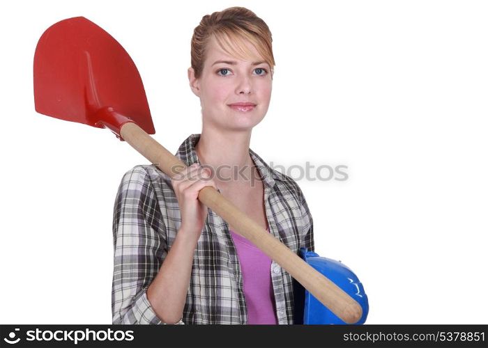 Woman with shovel over her shoulder