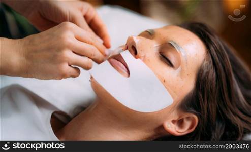 Woman with Skincare Face Mask in Beauty Salon