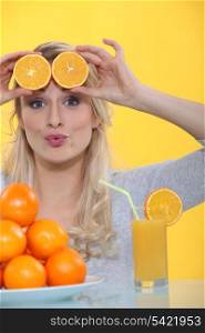 Woman with slices of orange on the forehead