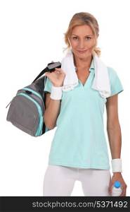Woman with sports bag over shoulder