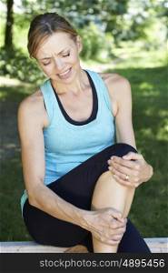 Woman With Sports Injury Sustained Whilst Exercising Outdoors