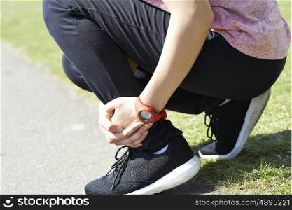 Woman With Sports Injury Sustained Whilst Jogging In Park