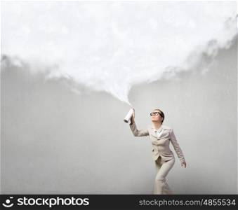 Woman with spray can. Pretty businesswoman spraying white cloud from container