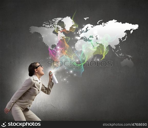 Woman with spray can. Young woman in suit and glasses spraying world map