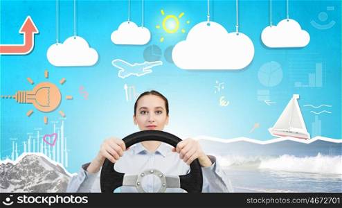 Woman with steering wheel. Young smiling pretty woman driving steering wheel