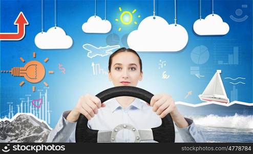 Woman with steering wheel. Young smiling pretty woman driving steering wheel