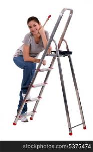 Woman with steps and a paintbrush