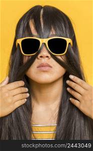 woman with sunglasses hair her face