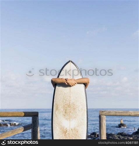 woman with surfboard beach