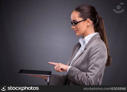 Woman with tablet computer in business concept