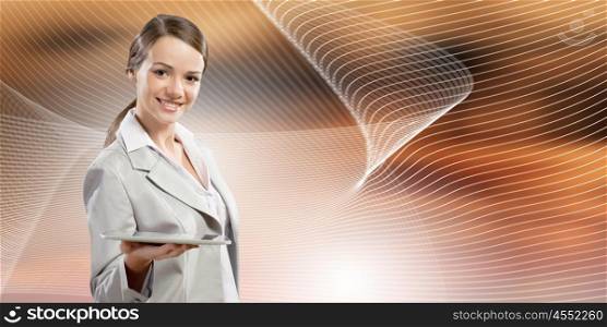 Woman with tablet pc. Attractive smiling businesswoman holding tablet pc in hands