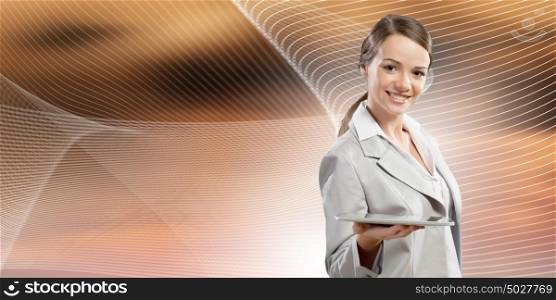 Woman with tablet pc. Attractive smiling businesswoman holding tablet pc in hands