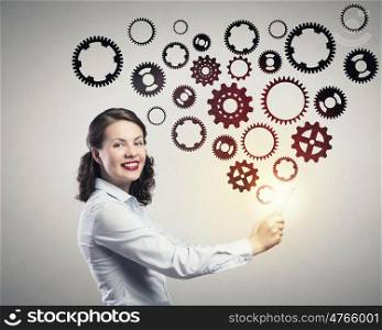 Woman with tablet pc. Woman using tablet pc and gear mechanism icons coming of screen
