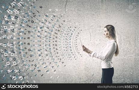 Woman with tablet pc. Young woman holding tablet pc in hands and letters flying around
