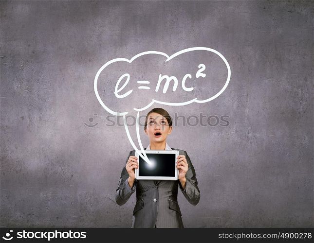 Woman with tablet. Young emotional woman holding in hands tablet pc