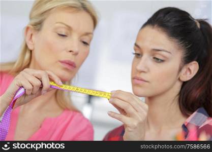 woman with tape measure worried about weight