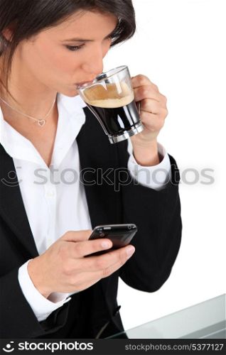 Woman with telephone and coffee
