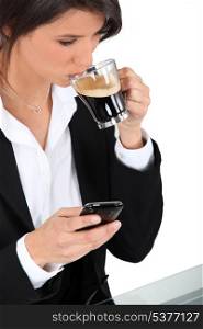 Woman with telephone and coffee