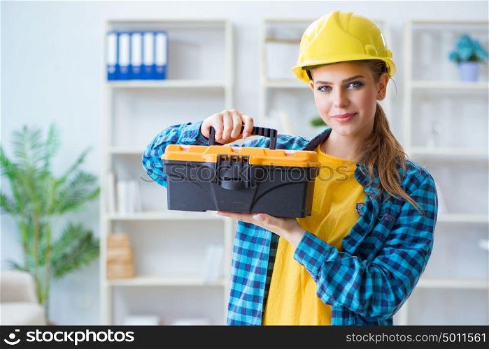 Woman with toolkit in workshop