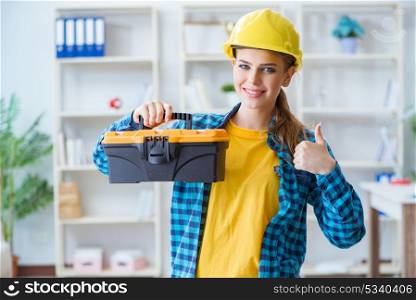 Woman with toolkit in workshop