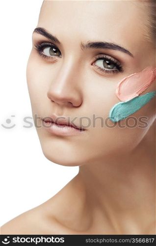 woman with two paint strokes on face on white background