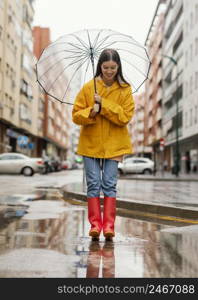 woman with umbrella standing rain long view