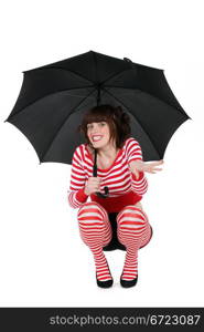 Woman with umbrella, studio shot