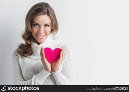 Woman with Valentines day heart. Beautiful woman holding Valentines day paper heart card