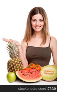 Woman with vegetables and fruits over white background