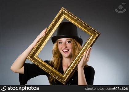 Woman with vintage hat and picture frame