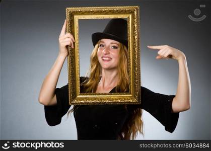 Woman with vintage hat and picture frame