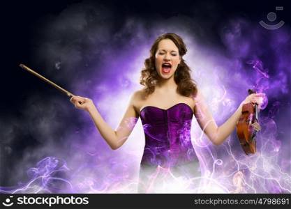 Woman with violin. Image of young singing woman holding violin