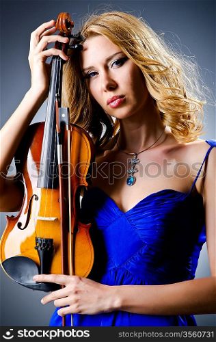 Woman with violin in studio