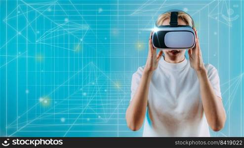 Woman with Virrtual Reality headset exploring metaverse world. Blue copy space
