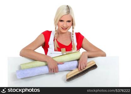 Woman with wallpaper rolls