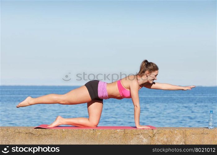 Woman with water after workout. Health and body care idea. Sporty fit attractive woman with bottle of water after exercising workout outdoor.