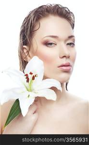woman with wet hair and white flower on white background