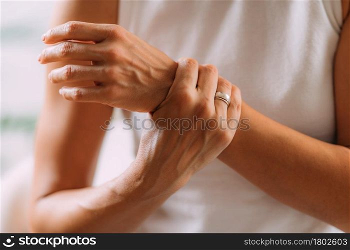 Woman with wrist pain.. Wrist Pain.