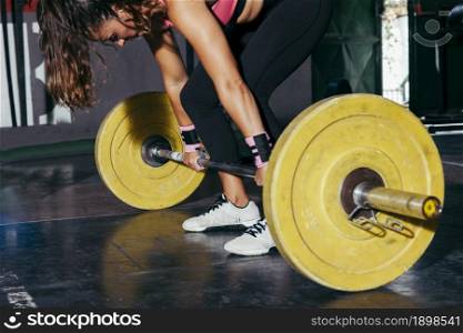 woman with yellow barbell gym. Resolution and high quality beautiful photo. woman with yellow barbell gym. High quality beautiful photo concept